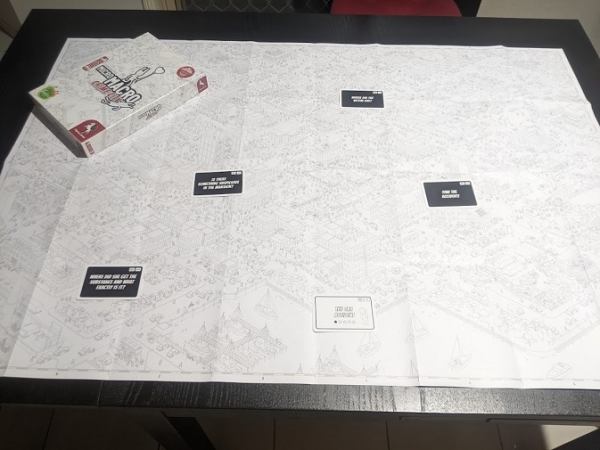 The map of Micro Macro Crime City, with cards laid out to represent points of interest.